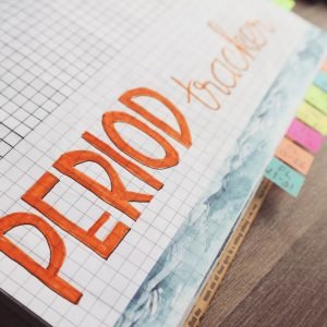 graph paper with the words PERIOD TRACKER in orange