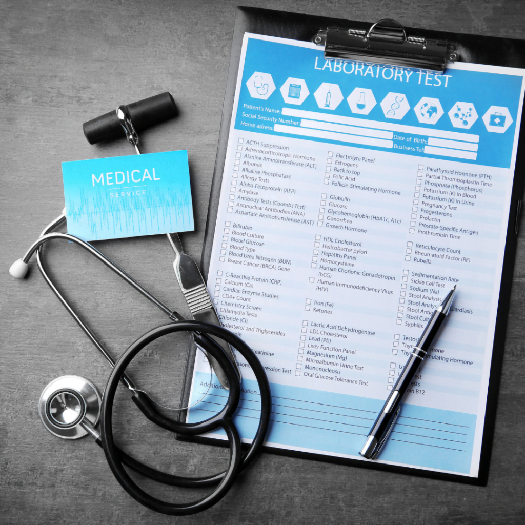 clip board with a lab test requisition and a stethoscope and pen beside it