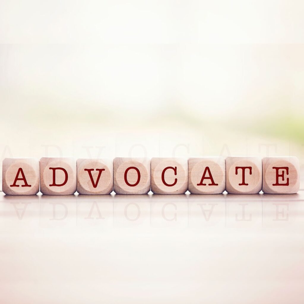 small wooden blocks spelling out ADVOCATE