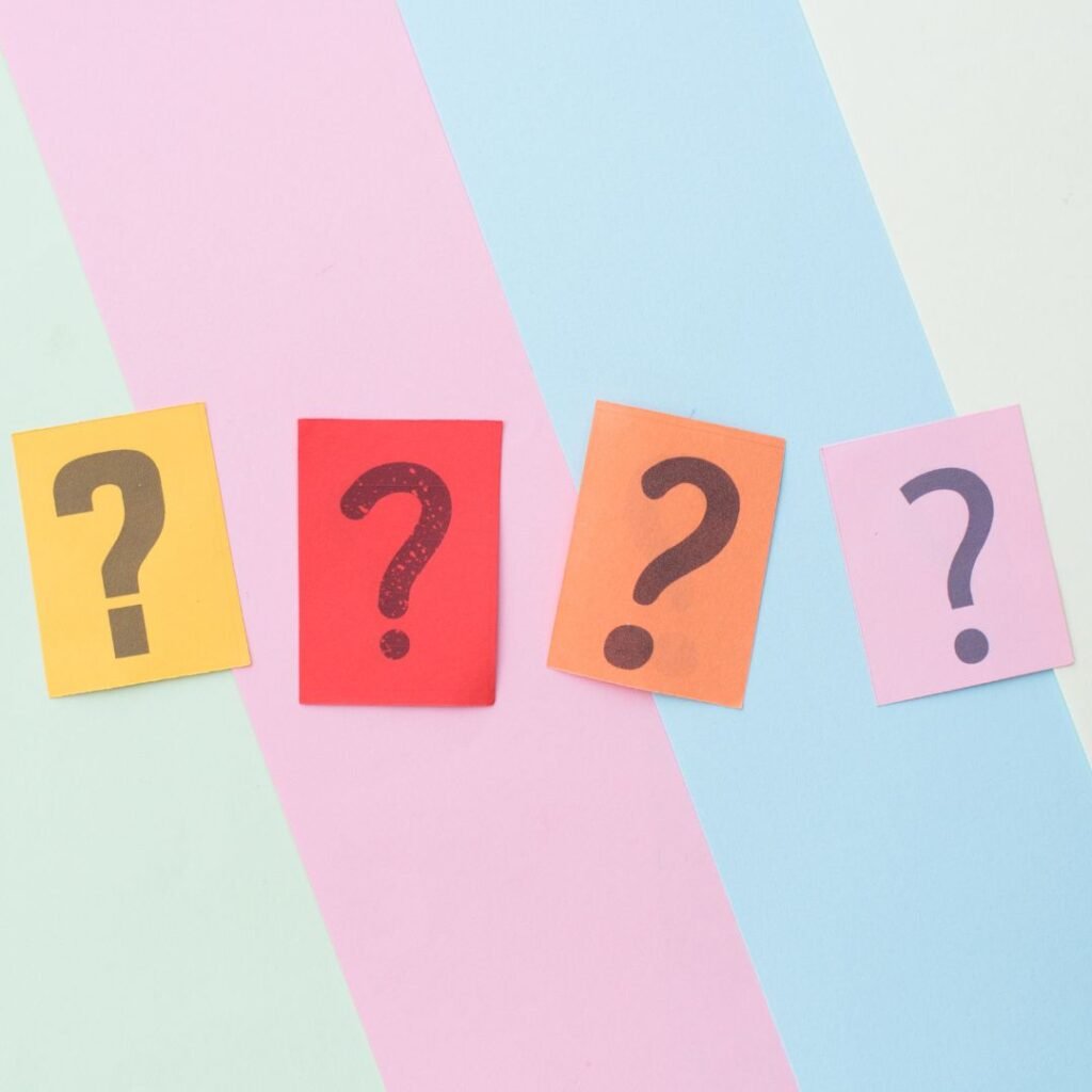 question mark stickies x4 over a striped background