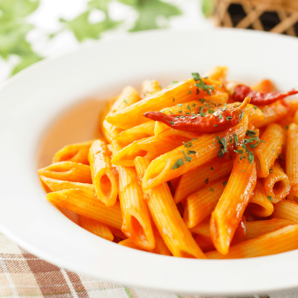 bowl of penne with red sauce