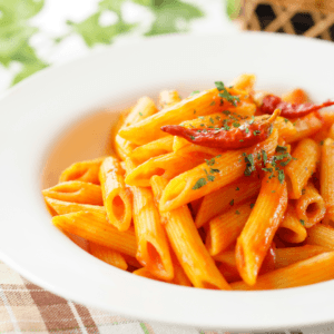 bowl of penne with red sauce